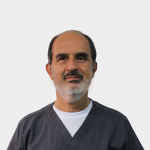 The photo was taken in the foreground, white background and Professor Guillermo Gómez Moya is located in the center.