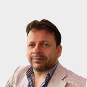 The photo was taken in foreground, white background and Professor Jonny Edward Duque Luna is located in the center.