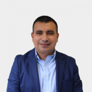 The photo was taken in close-up, with a white background, and the professor Jairo Blanco Solano is positioned in the center.