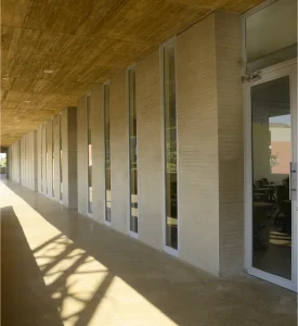 Photo of one of the corridors of the building showing the doors of several classrooms.