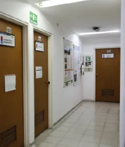 General shot of a corridor with the doors of the laboratories of the School of Physical Therapy.