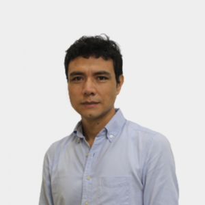 The photo was taken in the foreground, white background and the professor Elder Jesús Villamizar Roa is located in the center.