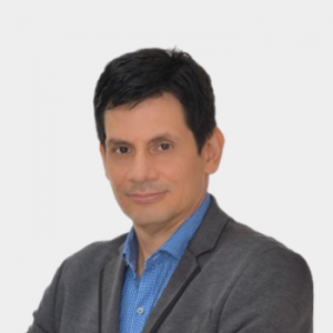 The photo was taken in the foreground, white background and the professor Fernando Rondón Gonzalez is located in the center.