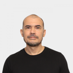 The photo was taken in the foreground, white background and the professor Fabián Alirio Ríos Angarita is located in the center
