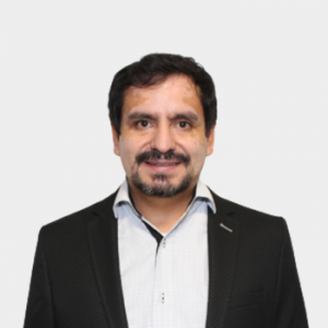 The photo was taken in the foreground, white background and the professor Julio Roberto Pinzón Joya is located in the center.