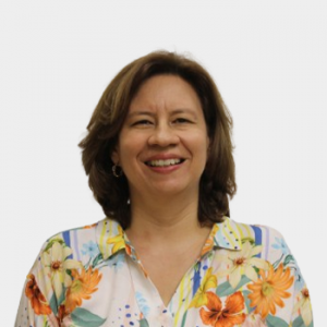The photo was taken in the foreground, white background and the professor is located in the center.