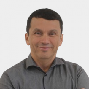 The photo was taken in the foreground, white background and Professor Cristian Blanco Tirado is located in the centre.