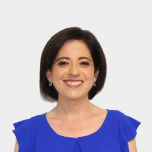 The photo was taken in the foreground, white background and Professor Lola Xiomara, is located in the center.