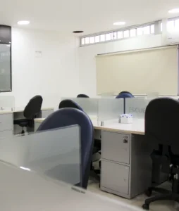 Photograph of the room showing desks and chairs for the students.