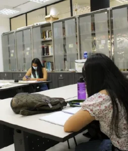 General shot of the room showing two students in the classroom