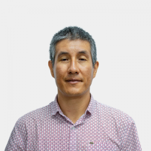 The photo was taken in the foreground, white background and Professor Jorge Enrique Buitrago Espitia is located in the centre.