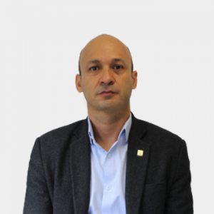 The photo was taken in the foreground, white background and Professor Johny Petite is located in the center.