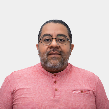 The photo was taken in the foreground, white background and Professor Angel Manuel Melendez is located in the centre.
