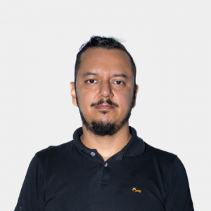The photo was taken in the foreground, white background and Professor Ivan Serna is located in the center.