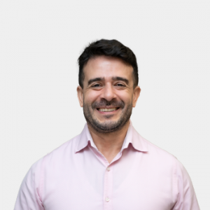 The photo was taken in close-up, on a white background, with the professor Andres Botero Bernal positioned in the center.