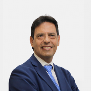 The photo was taken in the foreground, white background and the professor is located in the center.