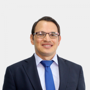 The photo was taken in foreground, white background and Professor Germán González Silva is located in the center.