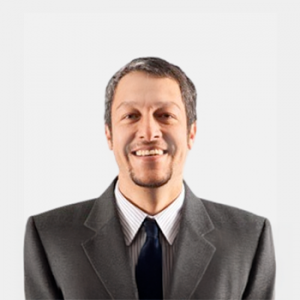 The photo was taken in the foreground, white background and the professor is located in the center.