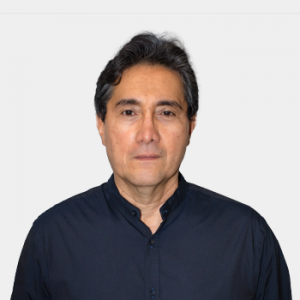 The photo was taken in the foreground, white background and the professor is located in the center.