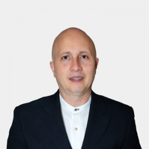 The photo was taken in the foreground, white background and the professor is located in the center.