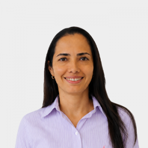 Photo in foreground; professor Ana Ramírez centered with a white background.