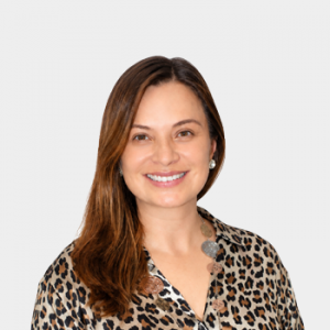 Photo in foreground; professor Edna Bravo centered with a white background.