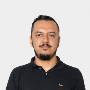 Photo in foreground; professor Ivan Serna centered with a white background.