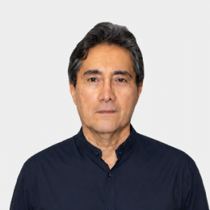Photo in foreground; professor Luis Becerra centered with a white background.