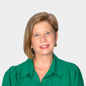 Photo in foreground; professor Mónica Botero centered with a white background.