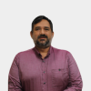 The photo was taken in the foreground, white background and the professor Gilberto Arenas Díaz is located in the center.